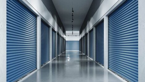 Inside storage facility looking down hallway with indoor units.