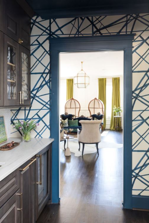 Gray decorated kitchen looking into living room.