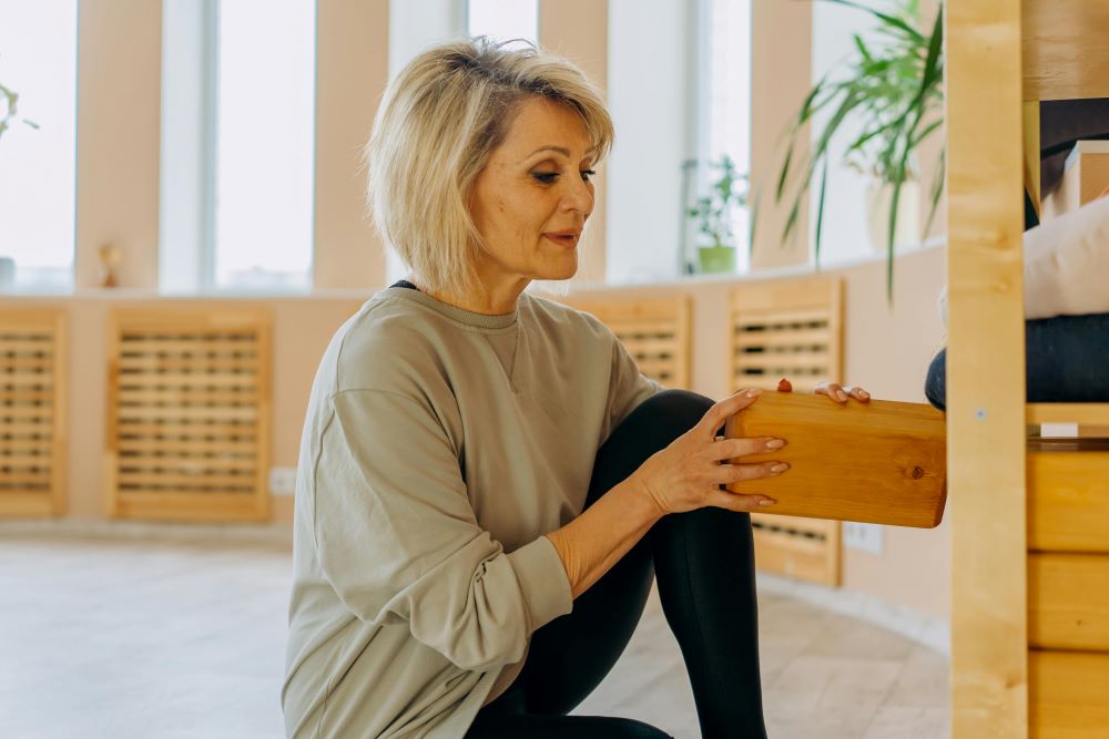 A woman holding a block.
Storing things correctly will keep their value.
